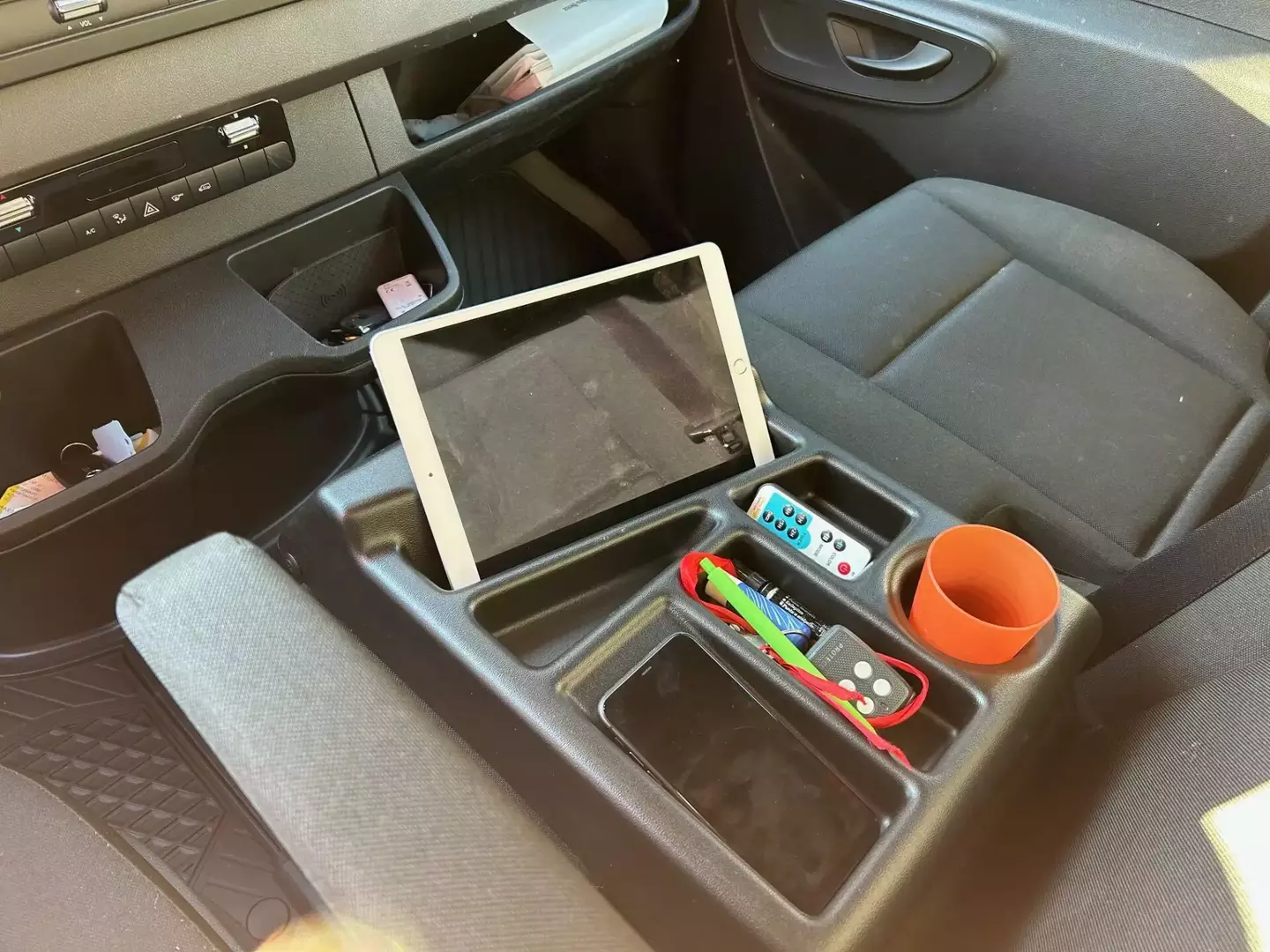 Openable storage compartment for the passenger seat
